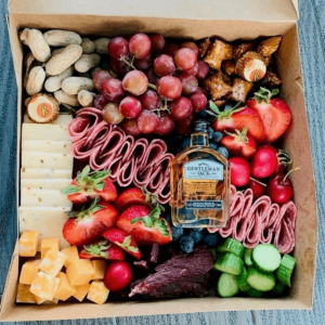 Medium box filled with assortment of meats, cheeses, fruit, and veggies
