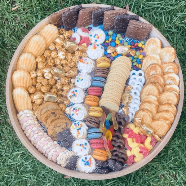 Sweets Board with assorted goodies such as chocolate, cookies, pretzels, etc.