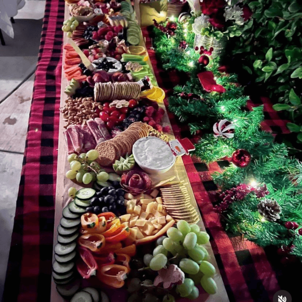 Long charcuterie board laid out on table