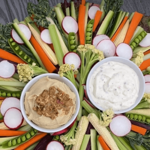 Veggie Board with assorted vegetables and dips.